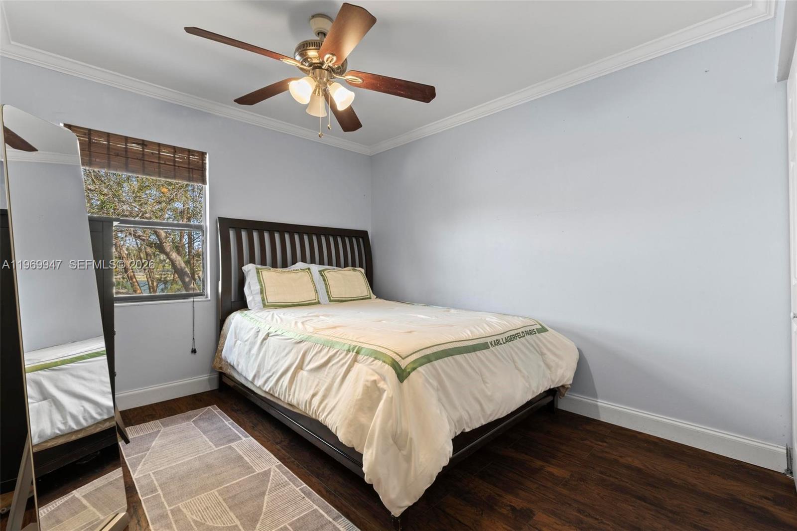 3370 Beau Rivage Drive, Unit B8 Pompano Beach, FL 33064 - Photo 9 of 33 a large bed sitting in a bedroom next to a window