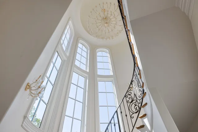 a kitchen with a sink cabinets and wooden floor