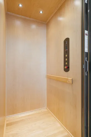 a kitchen with stainless steel appliances granite countertop a sink a stove counter space and wooden floor