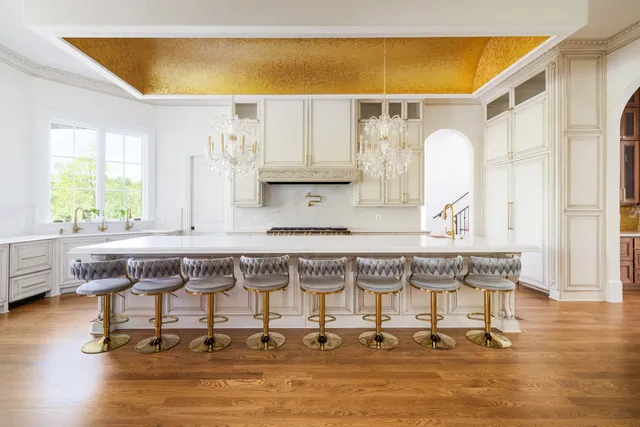a living room with a fireplace and a potted plant
