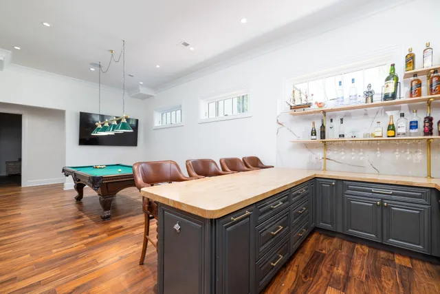 a view of a a dining room with furniture window and wooden floor
