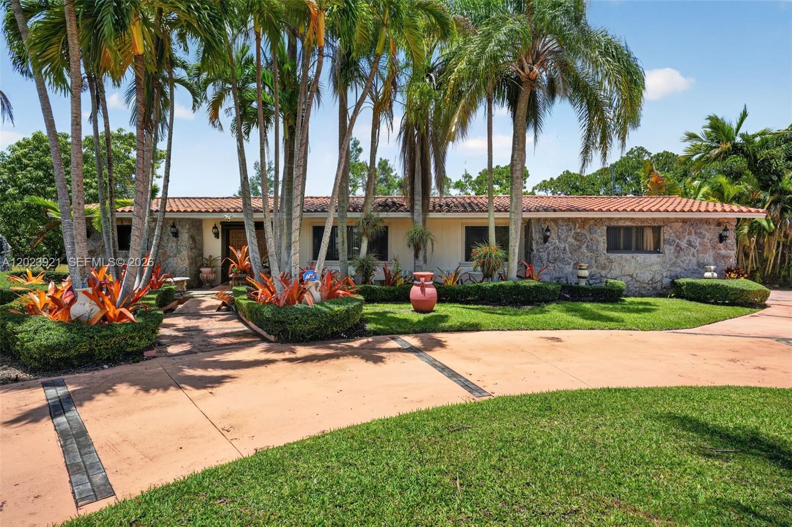 8461 Southwest 68th St Road Miami, FL 33143 - Photo 5 of 65 a front view of house with yard and green space