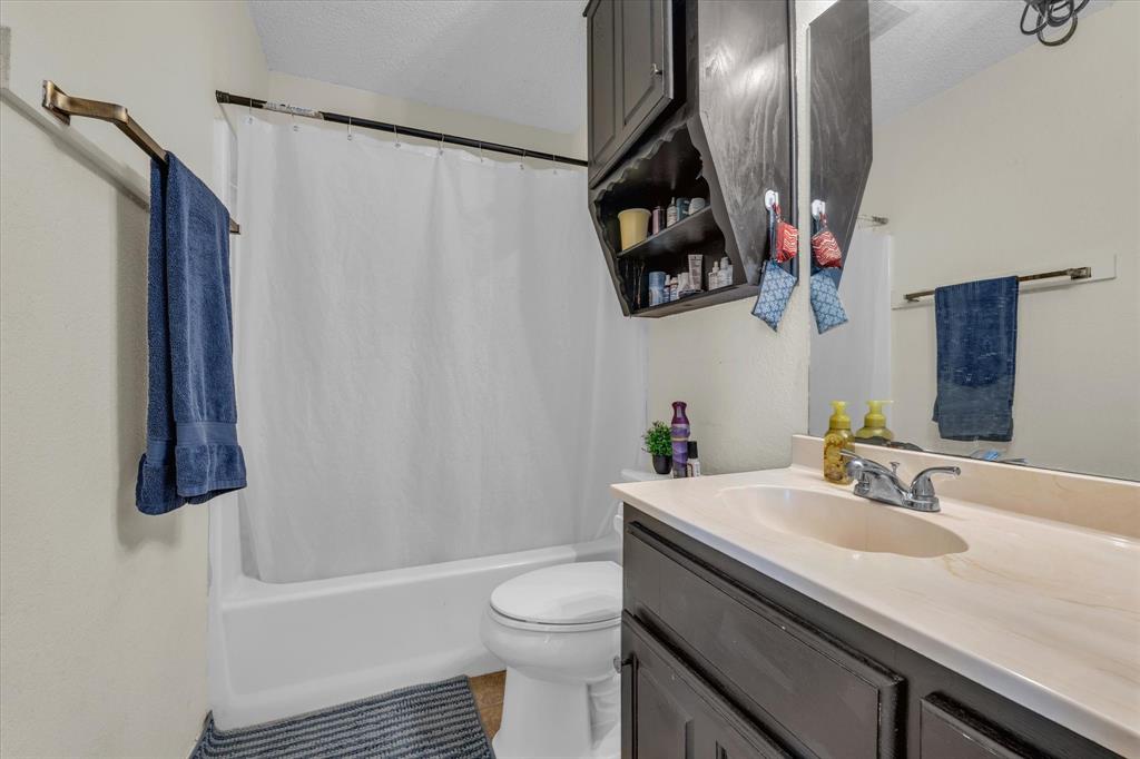 1349 South 11th Street Waco, TX 76706 - Photo 12 of 17 a bathroom with a sink toilet and shower
