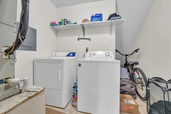 a utility room with dryer and washer