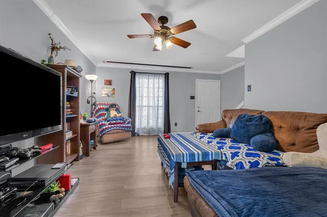 a living room with furniture and a flat screen tv