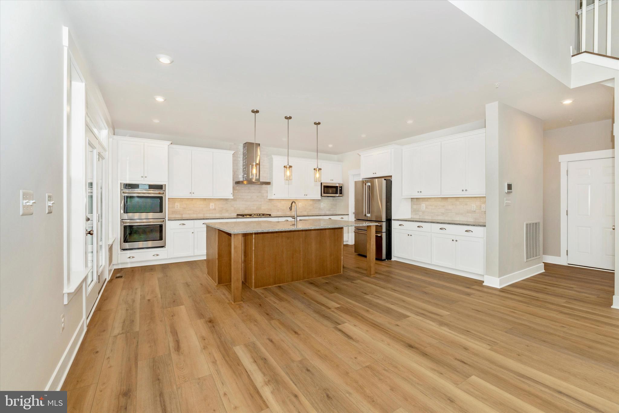 10230 Daysville Road Walkersville, MD 21793 - Photo 12 of 43 a large kitchen with a center island and stainless steel appliances