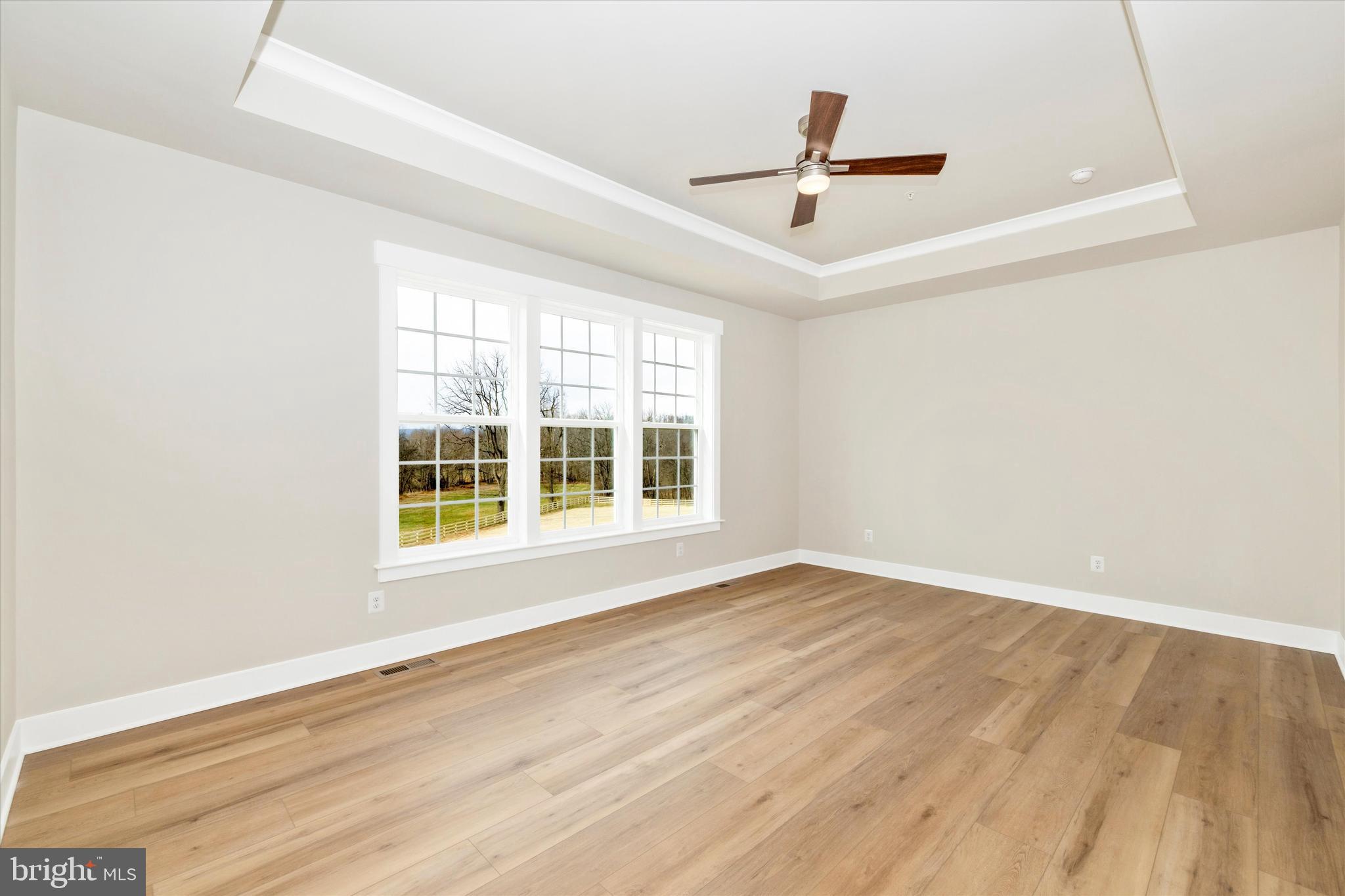 10230 Daysville Road Walkersville, MD 21793 - Photo 23 of 43 an empty room with wooden floor and windows