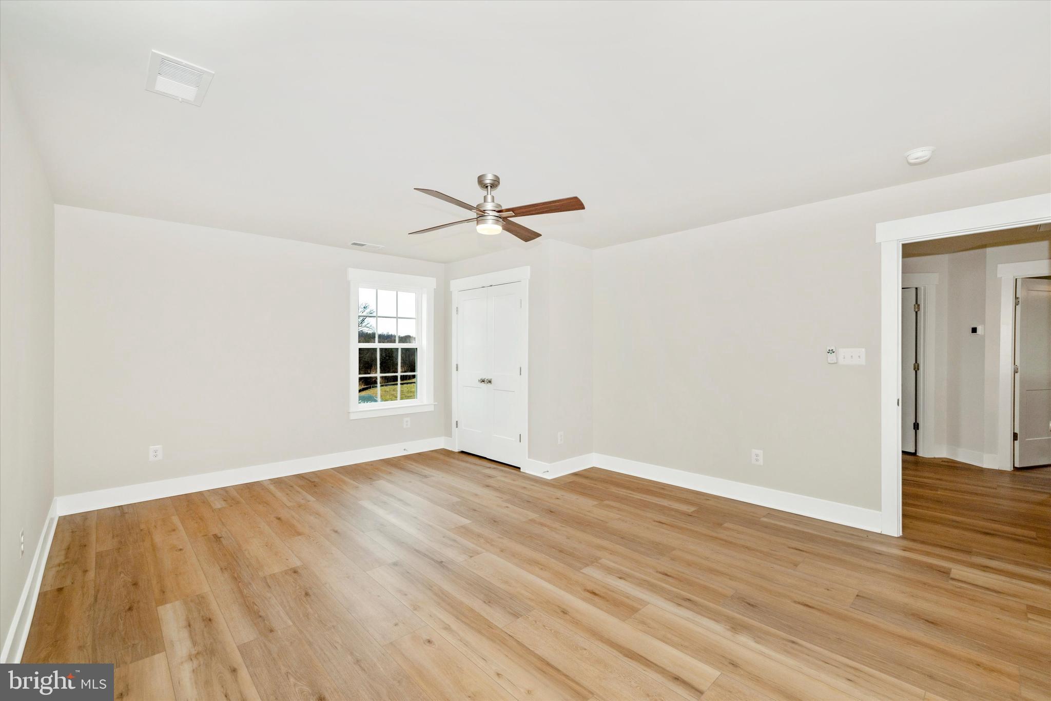 10230 Daysville Road Walkersville, MD 21793 - Photo 28 of 43 wooden floor in an empty room with a window