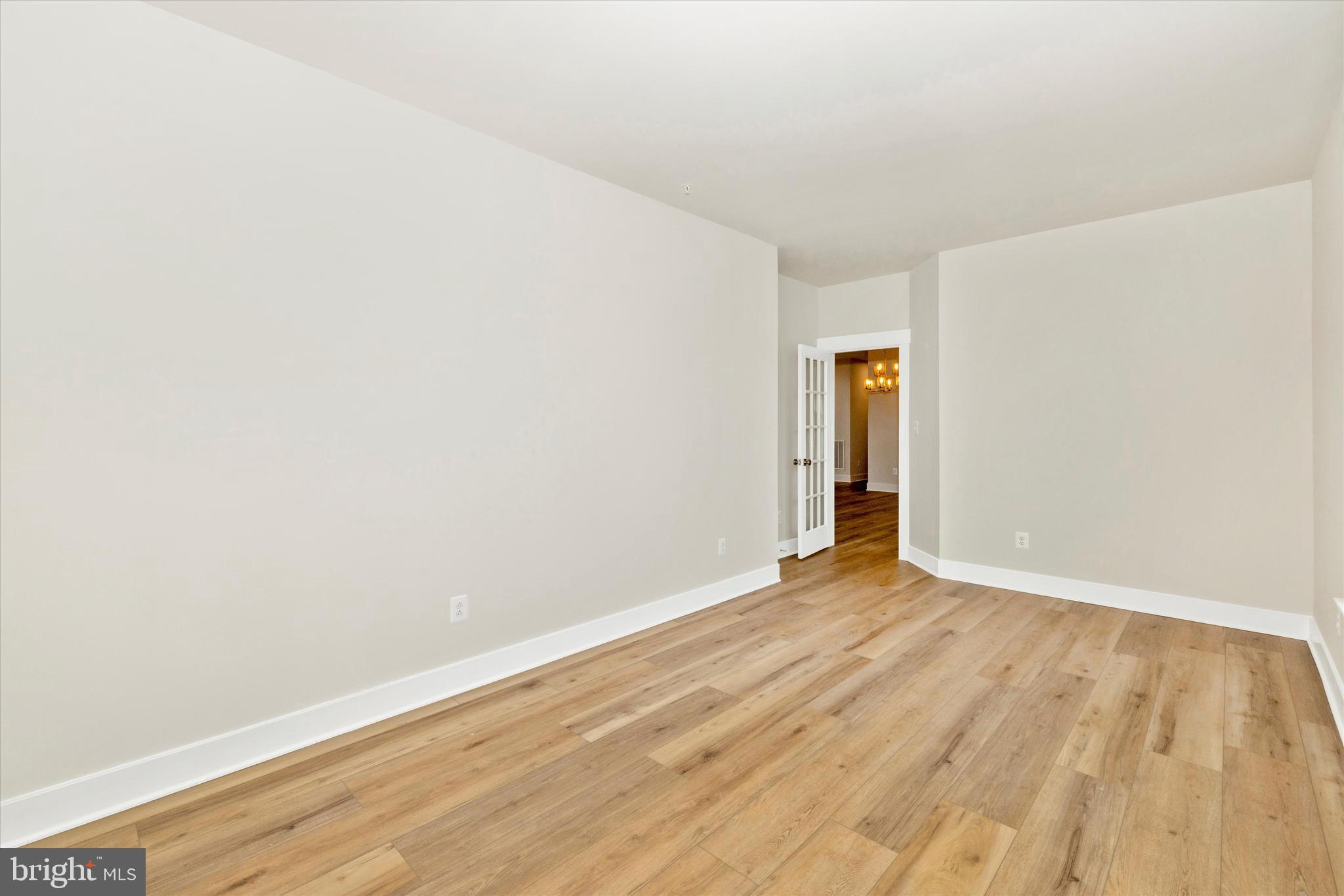10230 Daysville Road Walkersville, MD 21793 - Photo 6 of 43 a view of an empty room with wooden floor