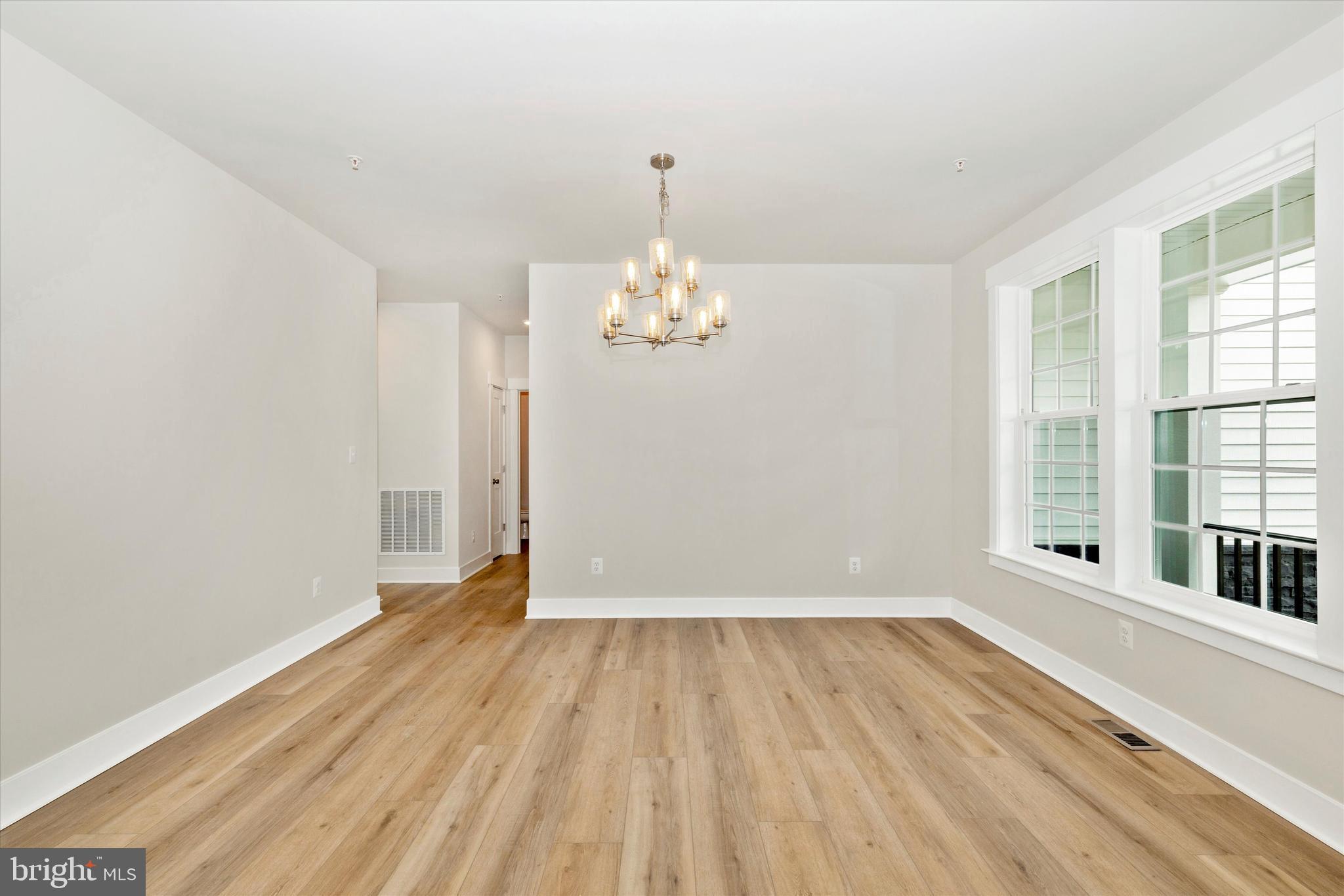 10230 Daysville Road Walkersville, MD 21793 - Photo 7 of 43 wooden floor in an empty room with a window