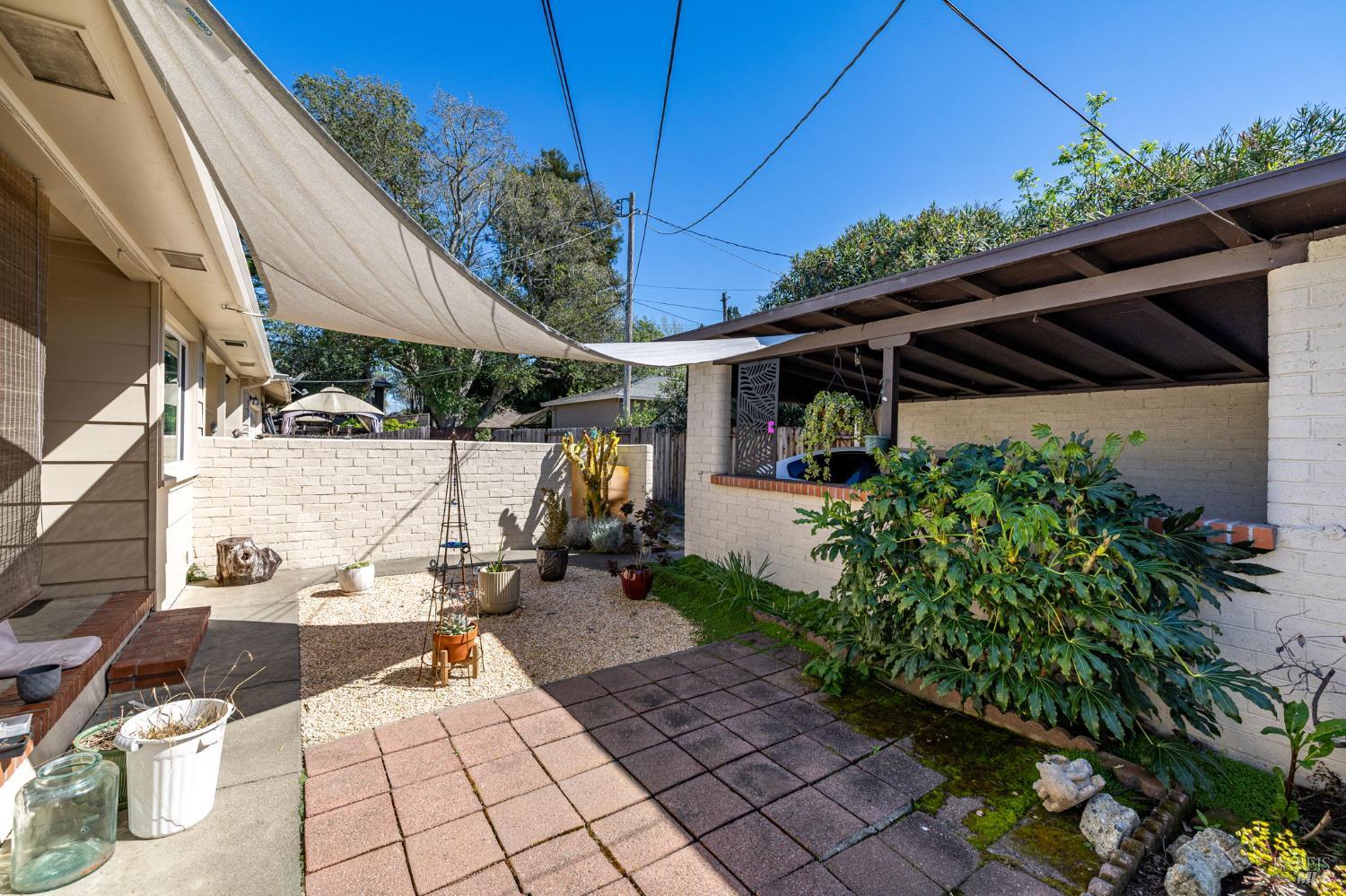 1204 14th Street Santa Rosa, CA 95404 - Photo 13 of 26 1206 14Th Street rear yard looking toward carport used for this unit