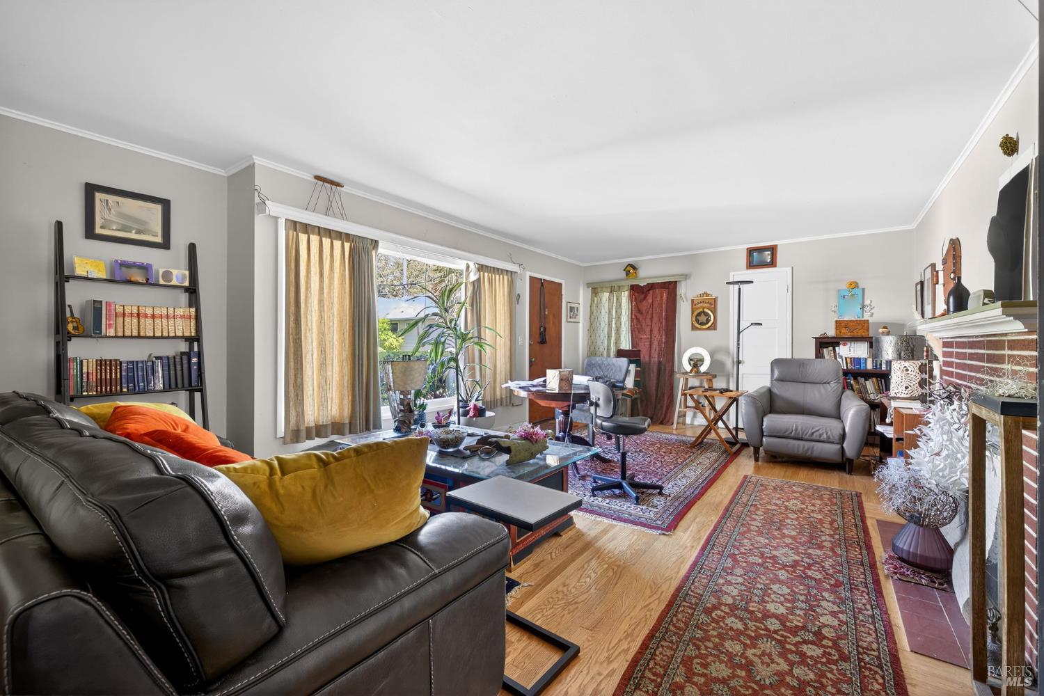 1204 14th Street Santa Rosa, CA 95404 - Photo 7 of 26 1206 14Th Street, Living room with hardwood flooring, fireplace and picture window.