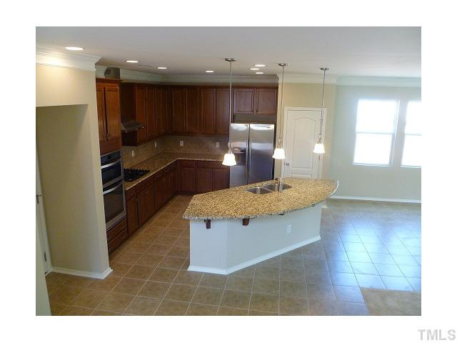 146 Daneborg Road Durham, NC 27703 - Photo 3 of 5 Granite, 42" cabinets, brushed nickel, tile floor, gas cooktop, double oven, stainless steel whirlpool appliances Kitchen