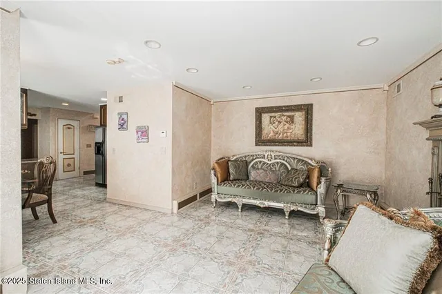 a living room with furniture and a table