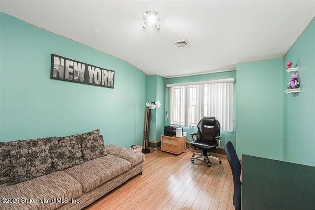 a living room with furniture and a window
