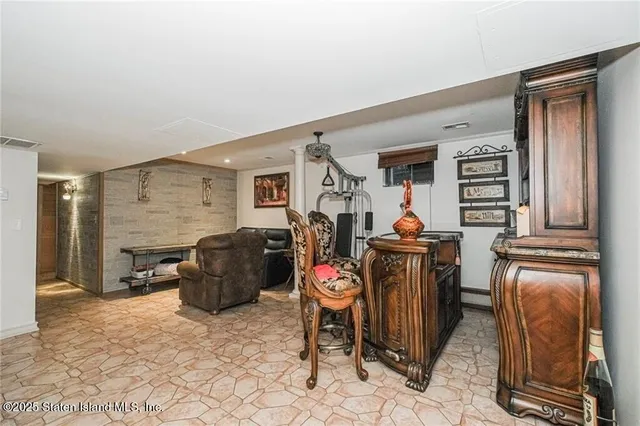 a living room with furniture a window and a fireplace