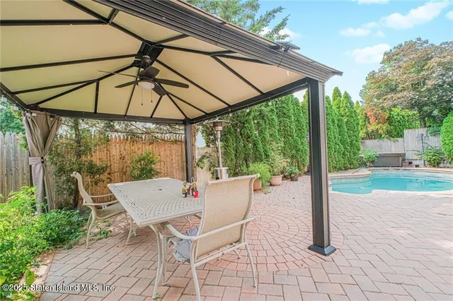 a view of a swimming pool with a patio