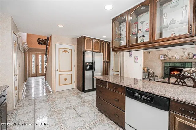 a kitchen with stainless steel appliances a refrigerator and a sink