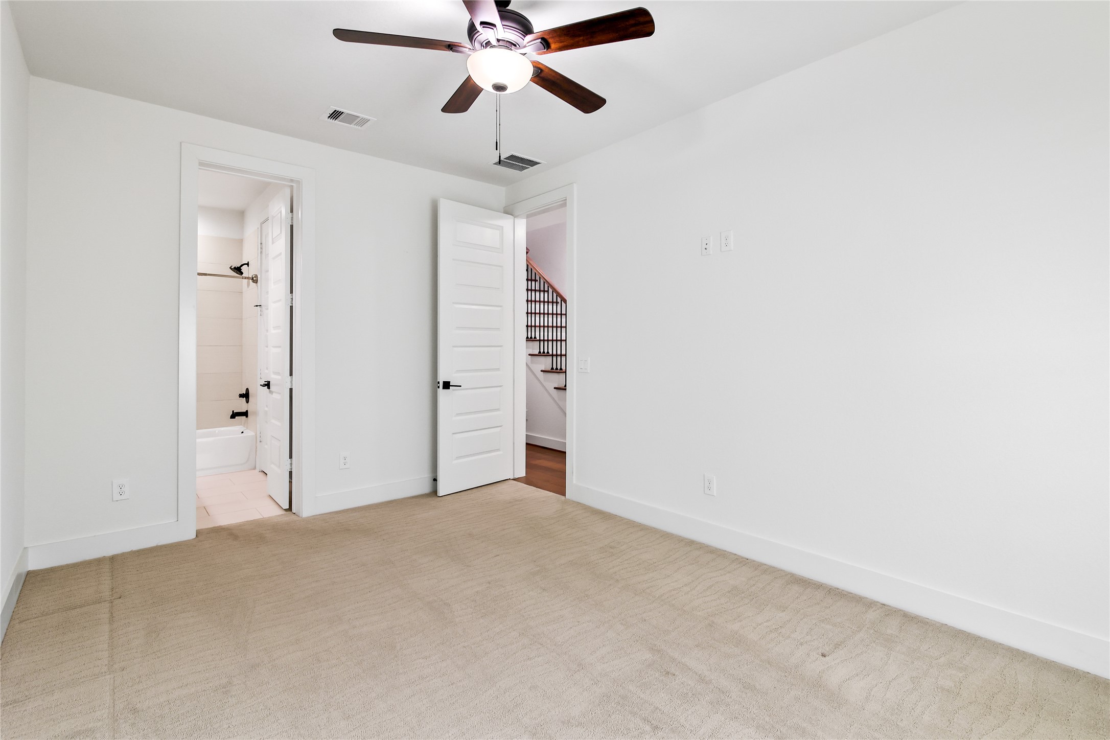 4231 Allen Street Houston, TX 77007 - Photo 13 of 31 an empty room with closet and a chandelier fan