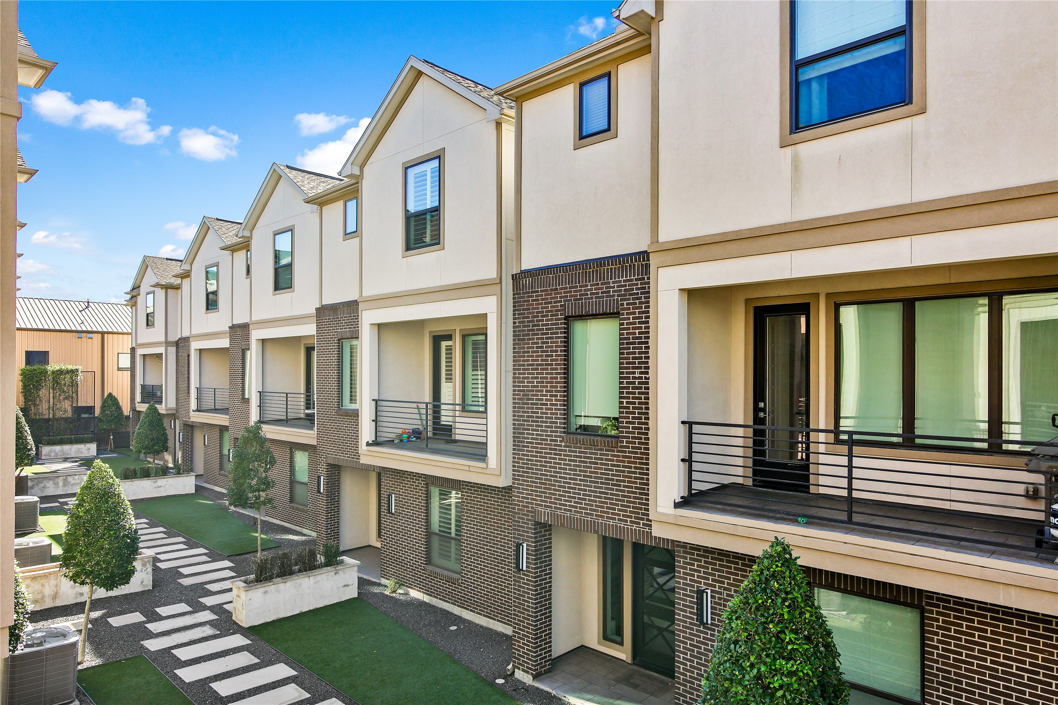 4231 Allen Street Houston, TX 77007 - Photo 16 of 31 a view of a brick building next to a yard