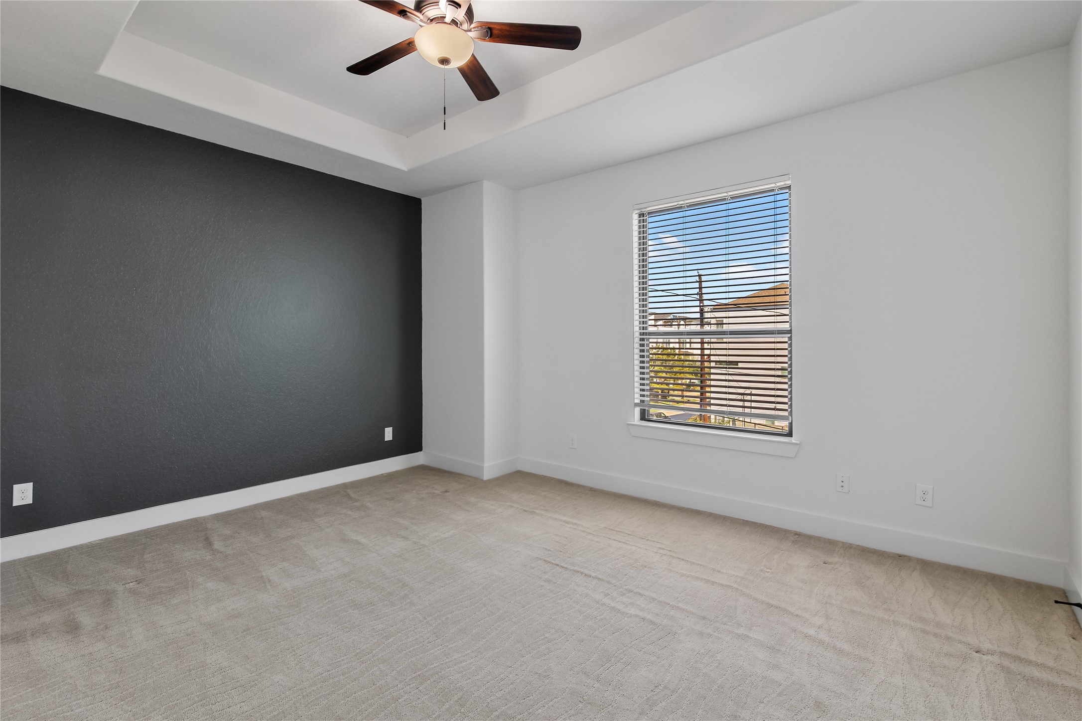 4231 Allen Street Houston, TX 77007 - Photo 17 of 31 an empty room with a ceiling fan and window