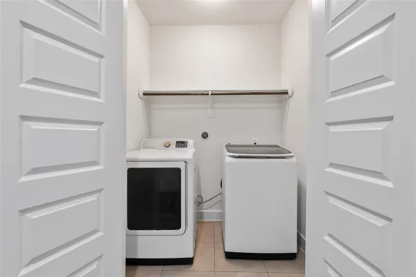 a utility room with washer and dryer
