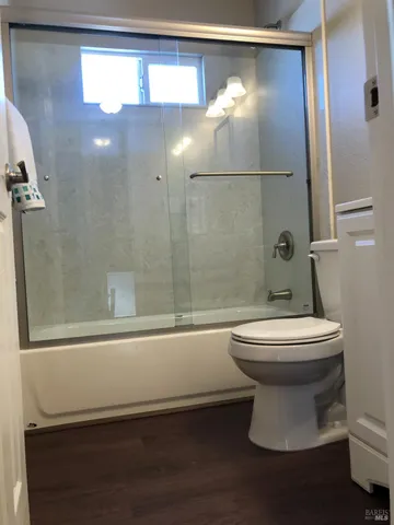 a bathroom with a toilet a sink and bathtub