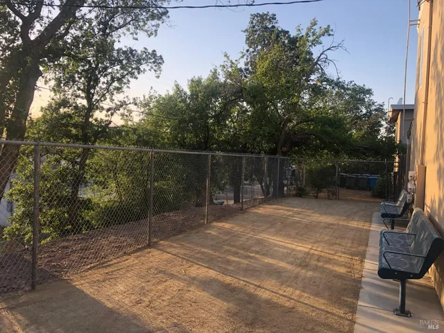 a backyard of a house with lots of green space