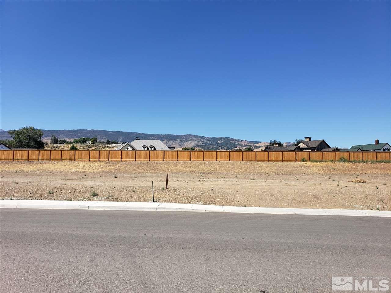 a view of a yard with an ocean view