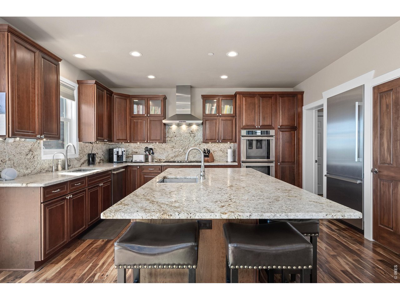 820 Peakview Road Boulder, CO 80302 - Photo 12 of 50 a kitchen with kitchen island a sink refrigerator and cabinets