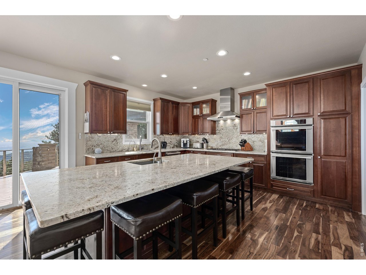 820 Peakview Road Boulder, CO 80302 - Photo 13 of 50 a kitchen with kitchen island a sink appliances and cabinets
