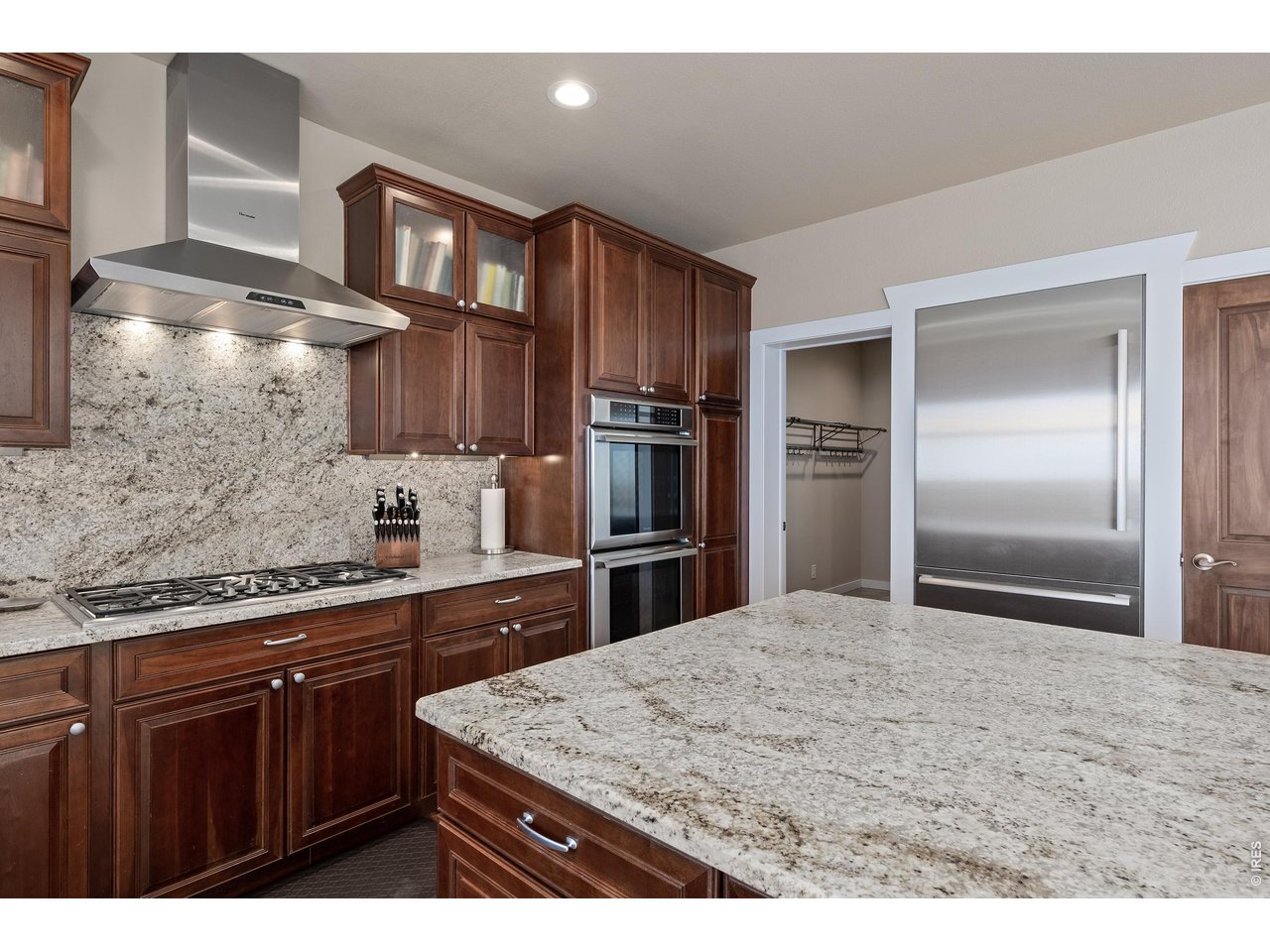 820 Peakview Road Boulder, CO 80302 - Photo 14 of 50 a kitchen with kitchen island a counter top space cabinets and stainless steel appliances