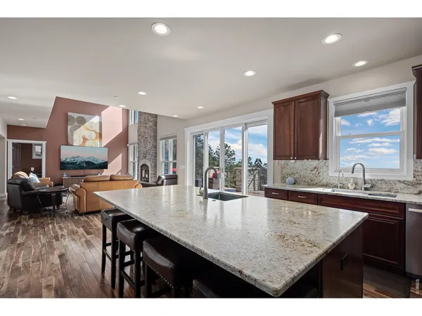 a kitchen with counter space dining table and chairs