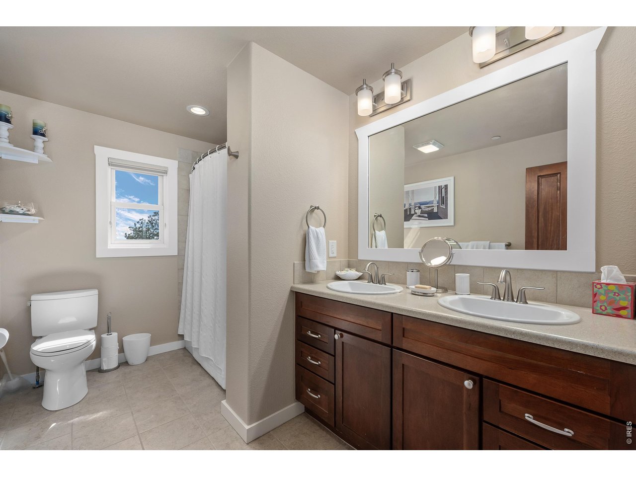 820 Peakview Road Boulder, CO 80302 - Photo 28 of 50 a bathroom with a toilet sink and mirror