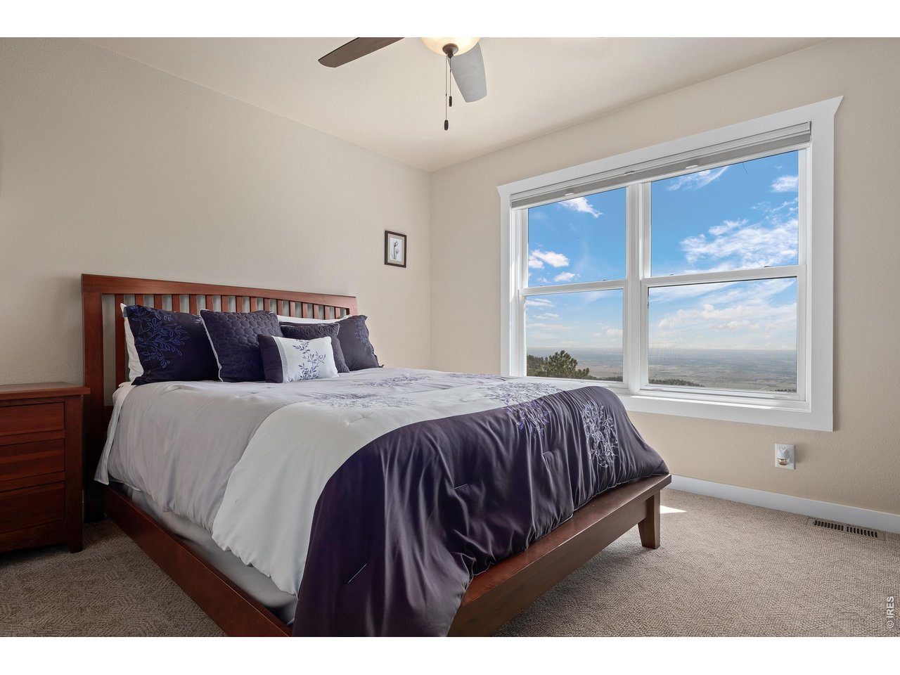 820 Peakview Road Boulder, CO 80302 - Photo 30 of 50 a bedroom with a large bed and a window