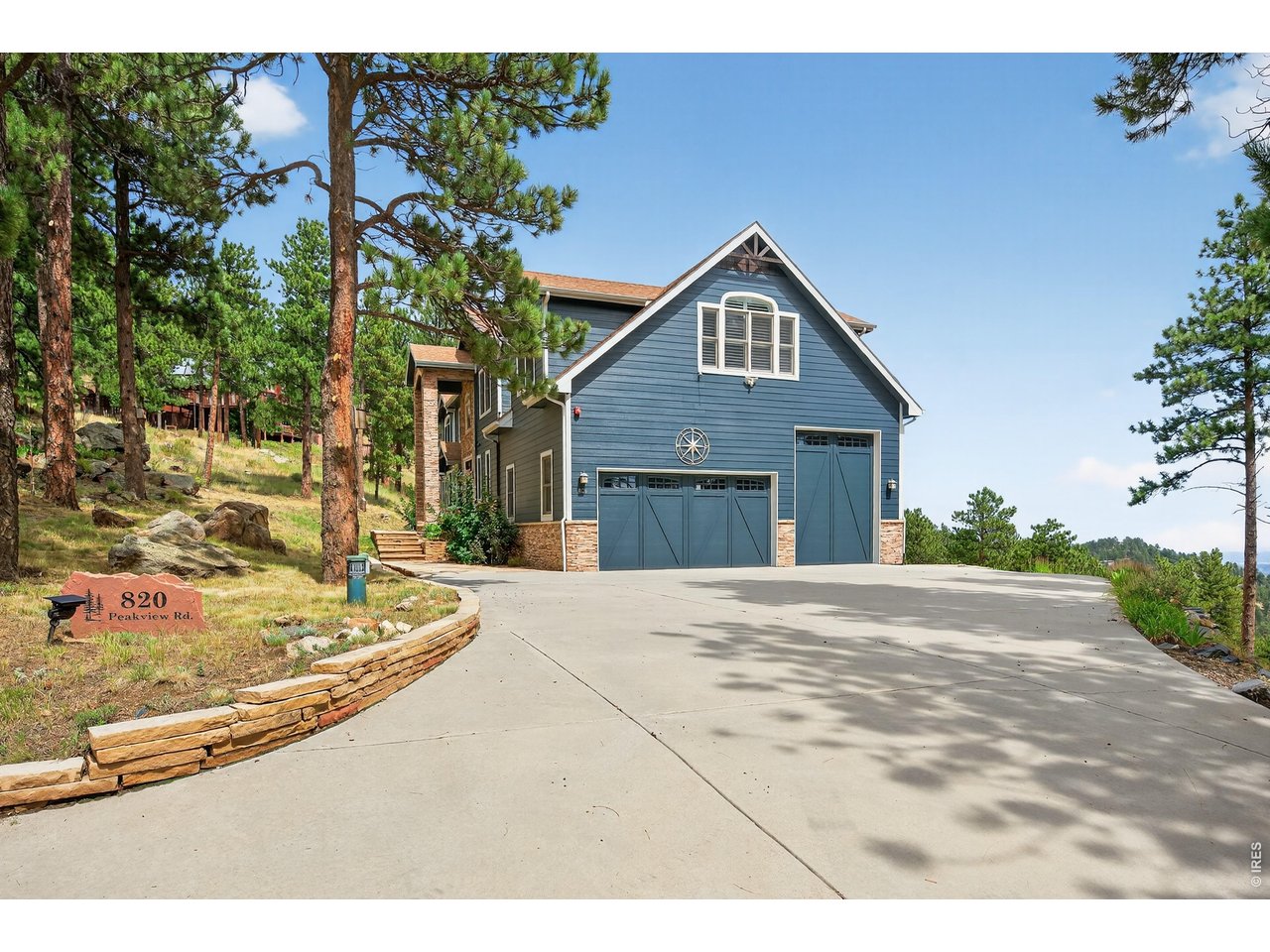 820 Peakview Road Boulder, CO 80302 - Photo 3 of 50 a front view of a house with a garden