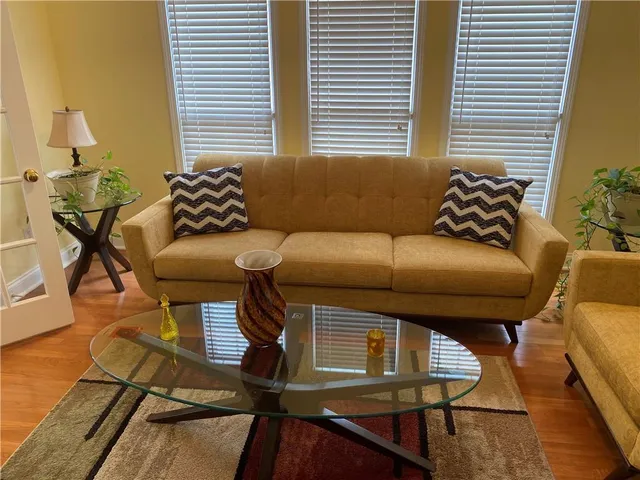 a bedroom with a bed and a chair