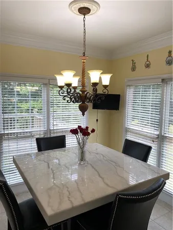 a kitchen with stainless steel appliances wooden cabinets and a stove top oven