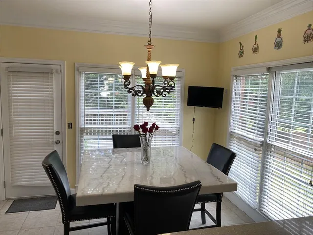 a kitchen with a sink a stove and cabinets