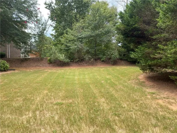 a view of a yard with an outdoor space