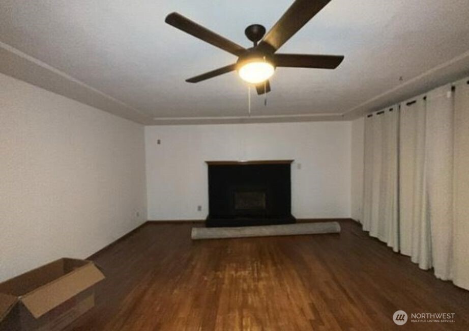 709 27th Avenue Milton, WA 98354 - Photo 3 of 5 wooden floor in an empty room