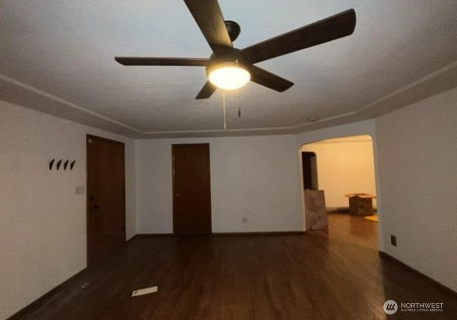 709 27th Avenue Milton, WA 98354 - Photo 4 of 5 a view of empty room with wooden floor and fan