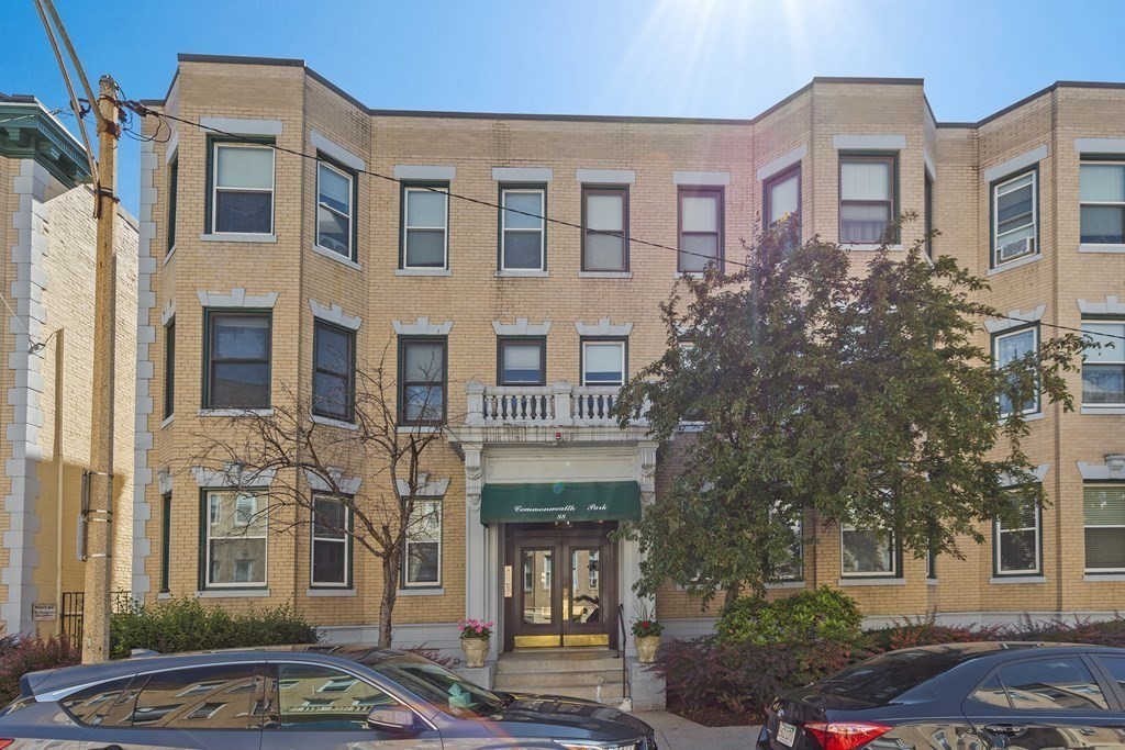 88 Gordon Street, Unit 204 Boston, MA 02135 - Photo 12 of 12 a front view of a residential apartment building with a yard