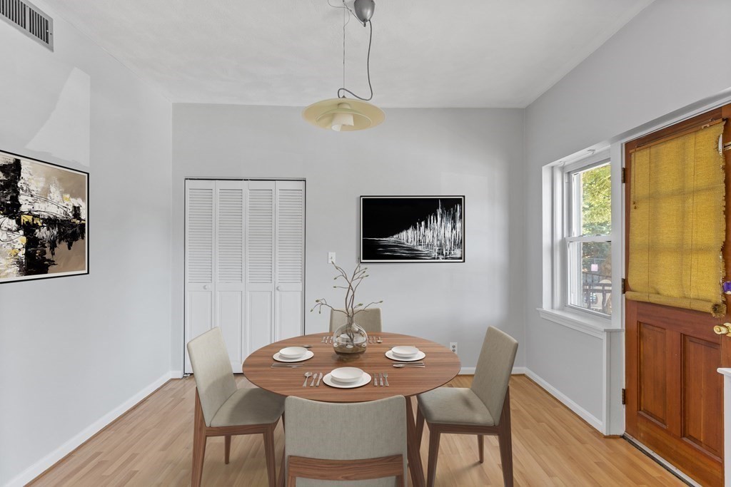 88 Gordon Street, Unit 204 Boston, MA 02135 - Photo 3 of 12 a view of a dining room with furniture window and wooden floor