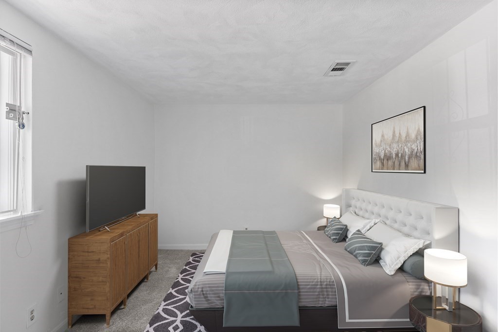 88 Gordon Street, Unit 204 Boston, MA 02135 - Photo 6 of 12 a bedroom with bed and a flat screen tv