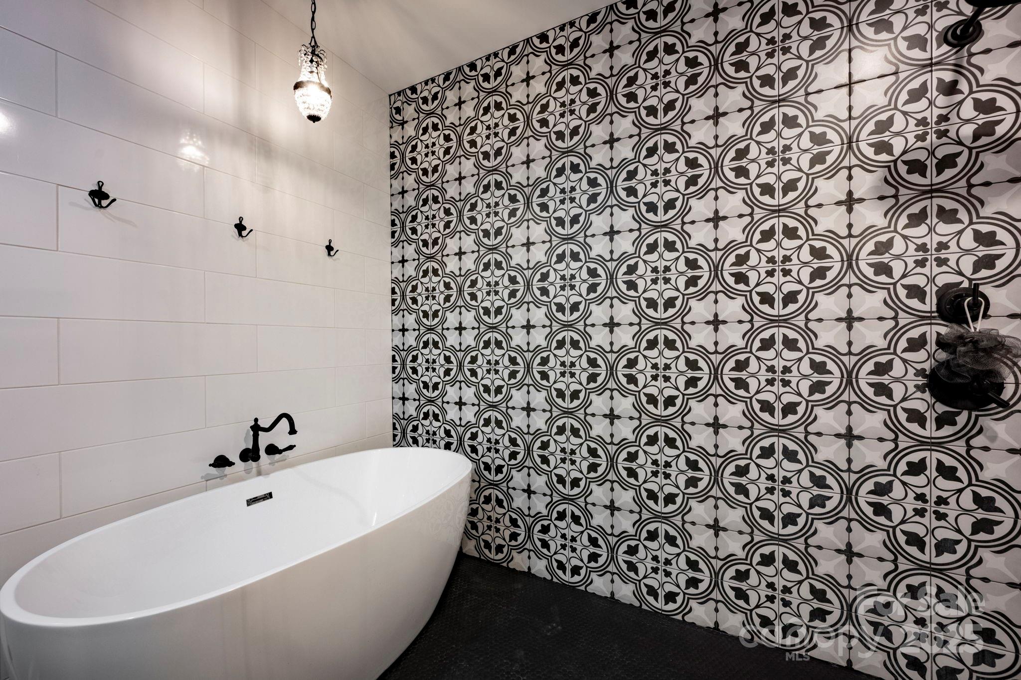 241 Spring Run Road Mooresville, NC 28117 - Photo 15 of 45 a bathroom with a bathtub and shower