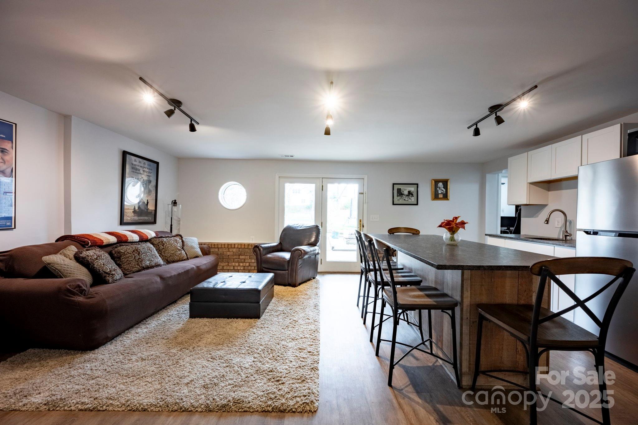 241 Spring Run Road Mooresville, NC 28117 - Photo 29 of 45 a living room with furniture and a wooden floor