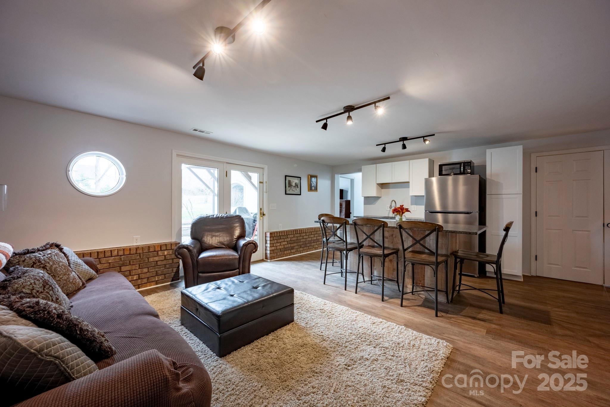241 Spring Run Road Mooresville, NC 28117 - Photo 30 of 45 a living room with furniture and wooden floor