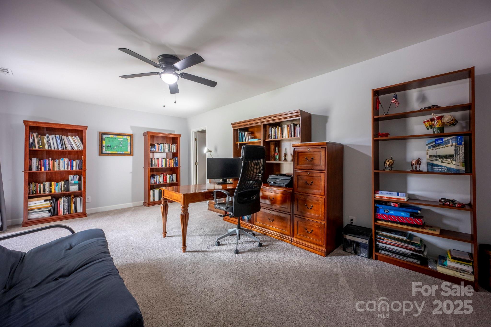 241 Spring Run Road Mooresville, NC 28117 - Photo 34 of 45 a bedroom with furniture and a book shelf