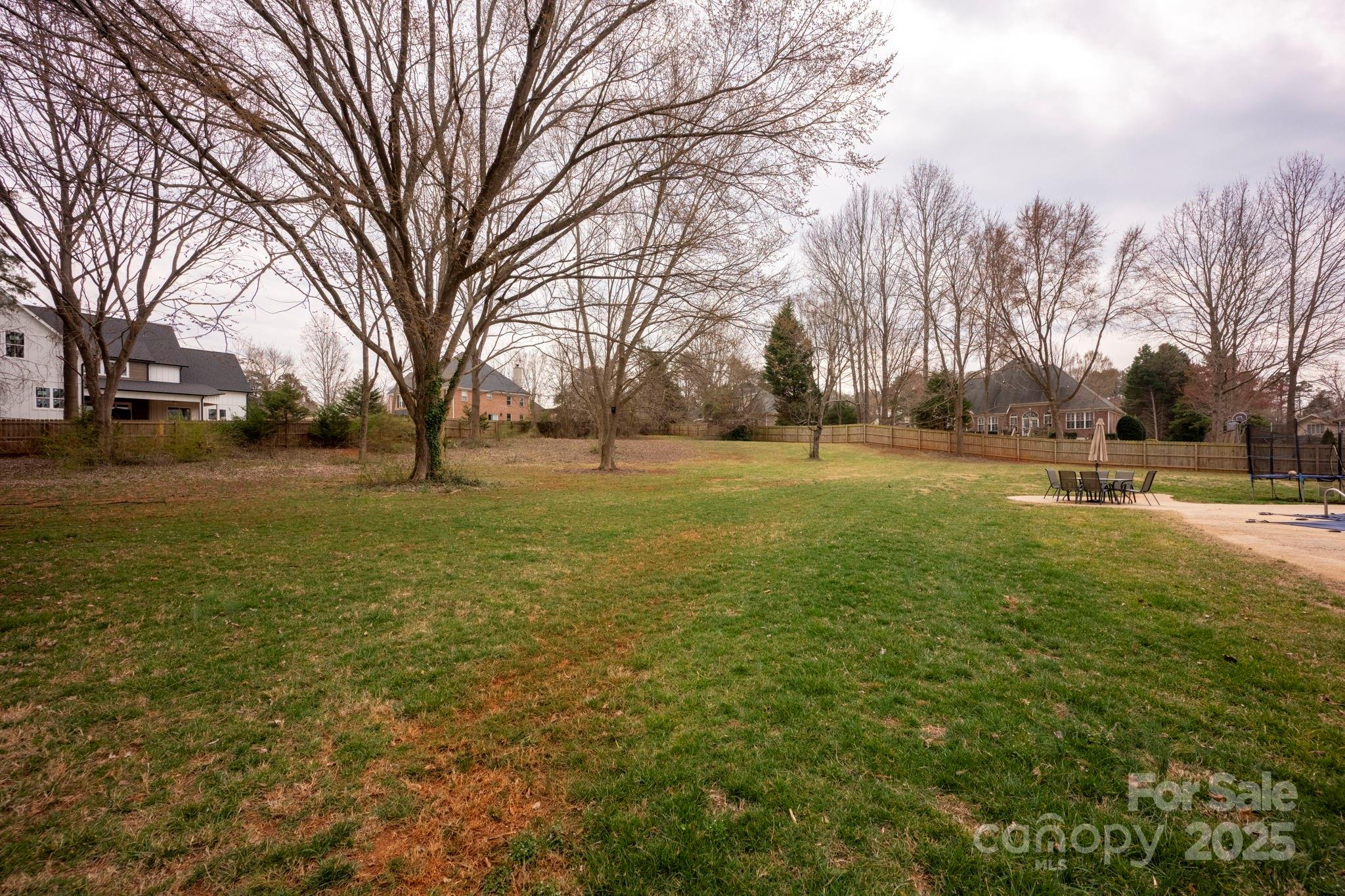 241 Spring Run Road Mooresville, NC 28117 - Photo 36 of 45 a view of a field with trees in the background